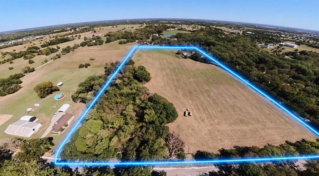 242 Oak Hill Road Van Alstyne, TX 75495 - Photo 2 of 10 Expansive land featuring a combination of open fields and mature tree lines, property lines are approximate .