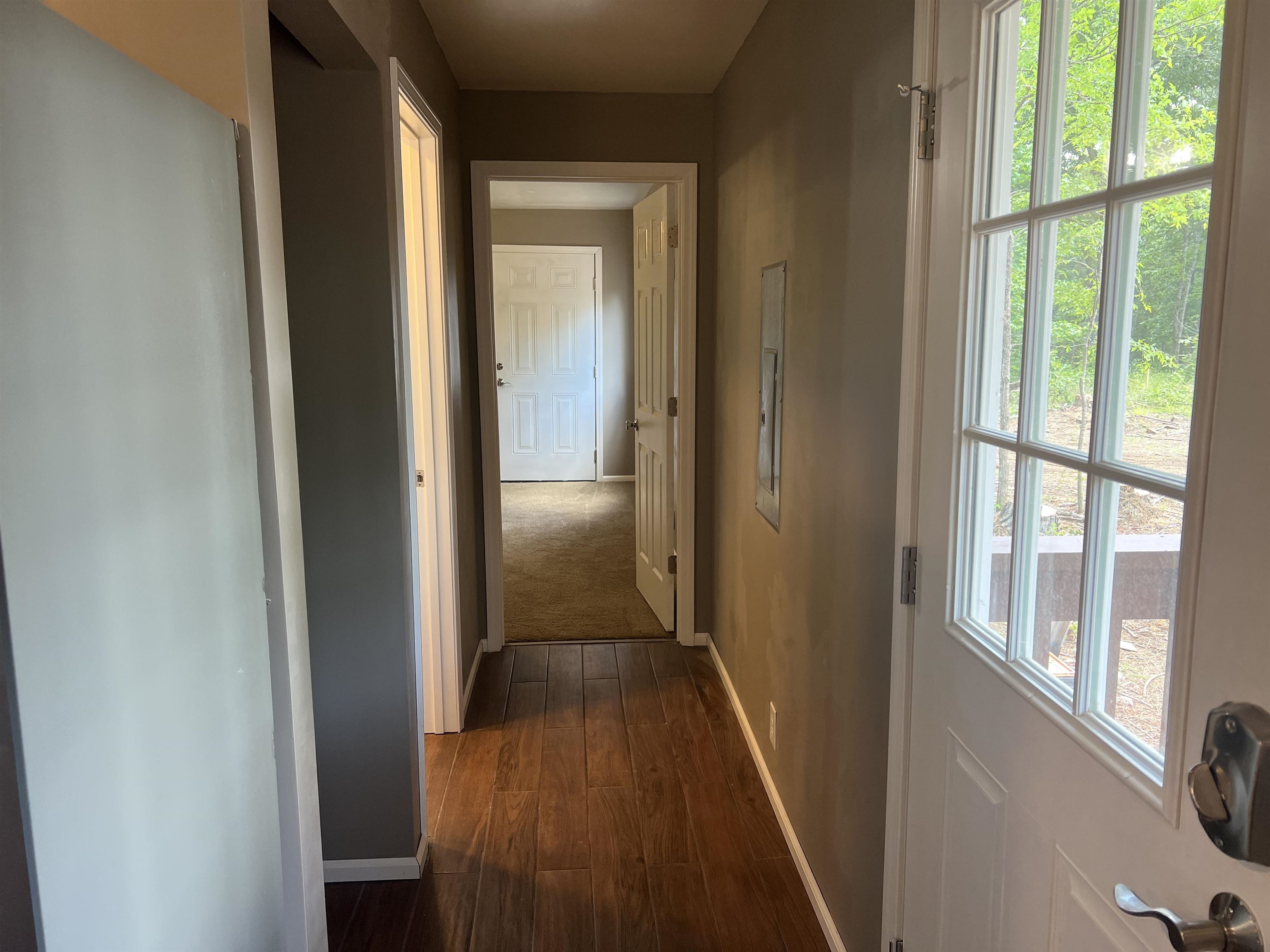 1525 Bullman Road Finger, TN 38334 - Photo 12 of 24 a view of a hallway with wooden floor and staircase