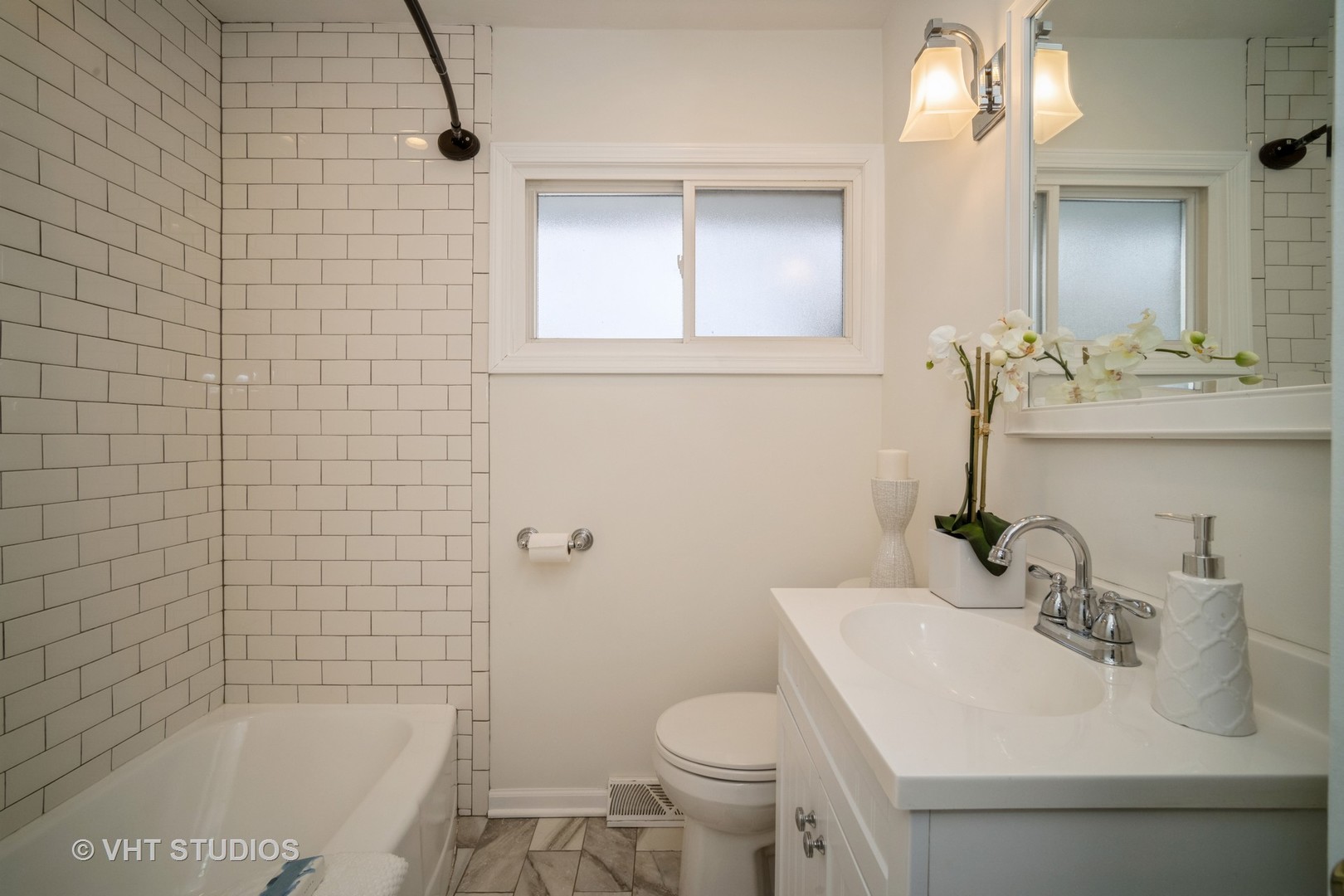 1137 Midway Road Northbrook, IL 60062 - Photo 8 of 18 a bathroom with a sink toilet and shower