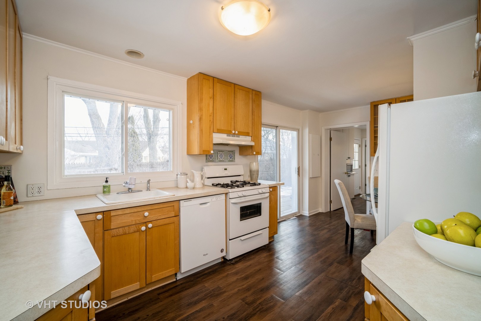 1137 Midway Road Northbrook, IL 60062 - Photo 9 of 18 a kitchen with a sink a refrigerator a window and cabinets