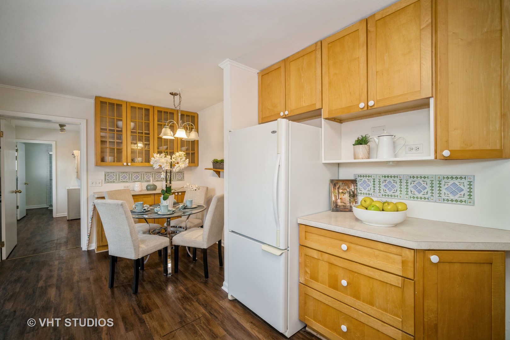 1137 Midway Road Northbrook, IL 60062 - Photo 10 of 18 a white kitchen with a refrigerator and table