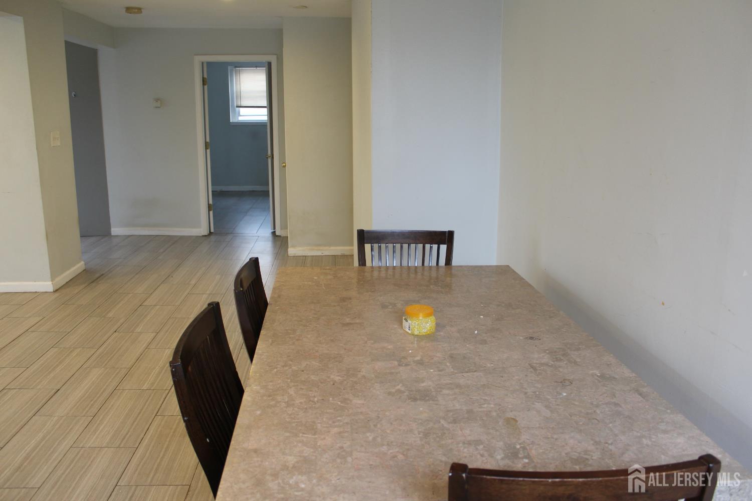 899 Green Street, Unit 1 Iselin, NJ 08830 - Photo 11 of 45 a view of a livingroom with a sink and a chair