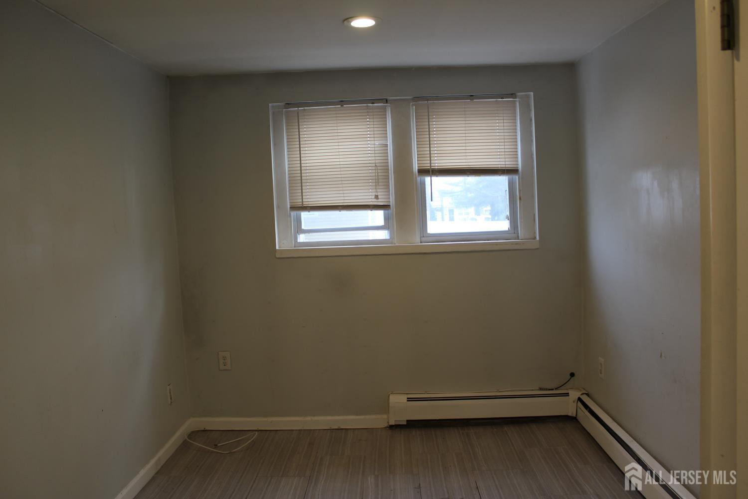 899 Green Street, Unit 1 Iselin, NJ 08830 - Photo 15 of 45 an empty room with a window