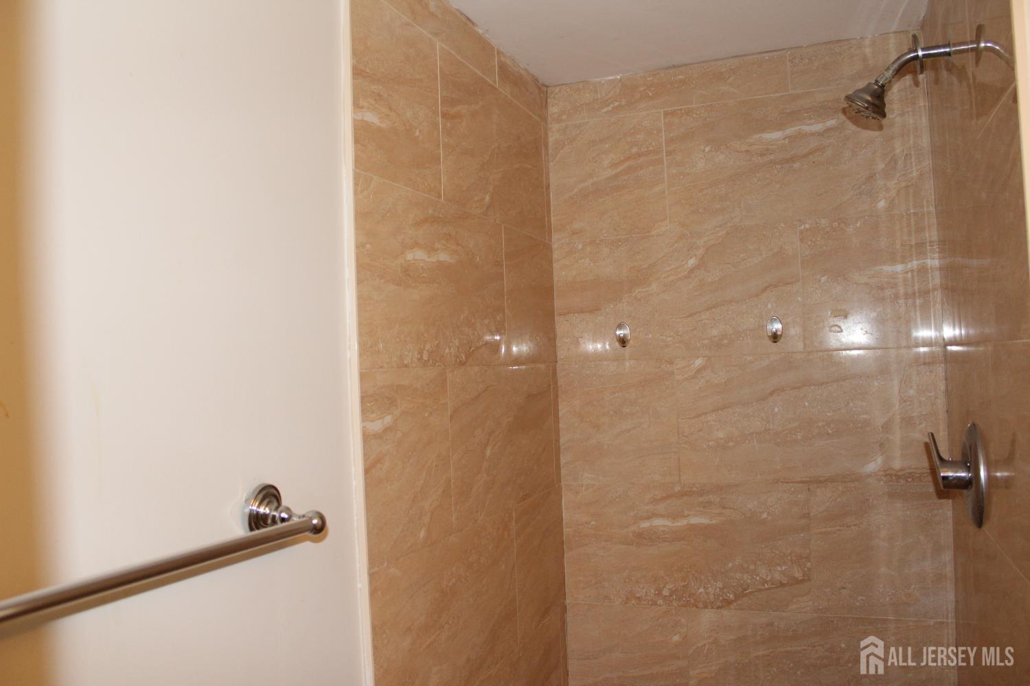 899 Green Street, Unit 1 Iselin, NJ 08830 - Photo 19 of 45 a bathroom with a shower