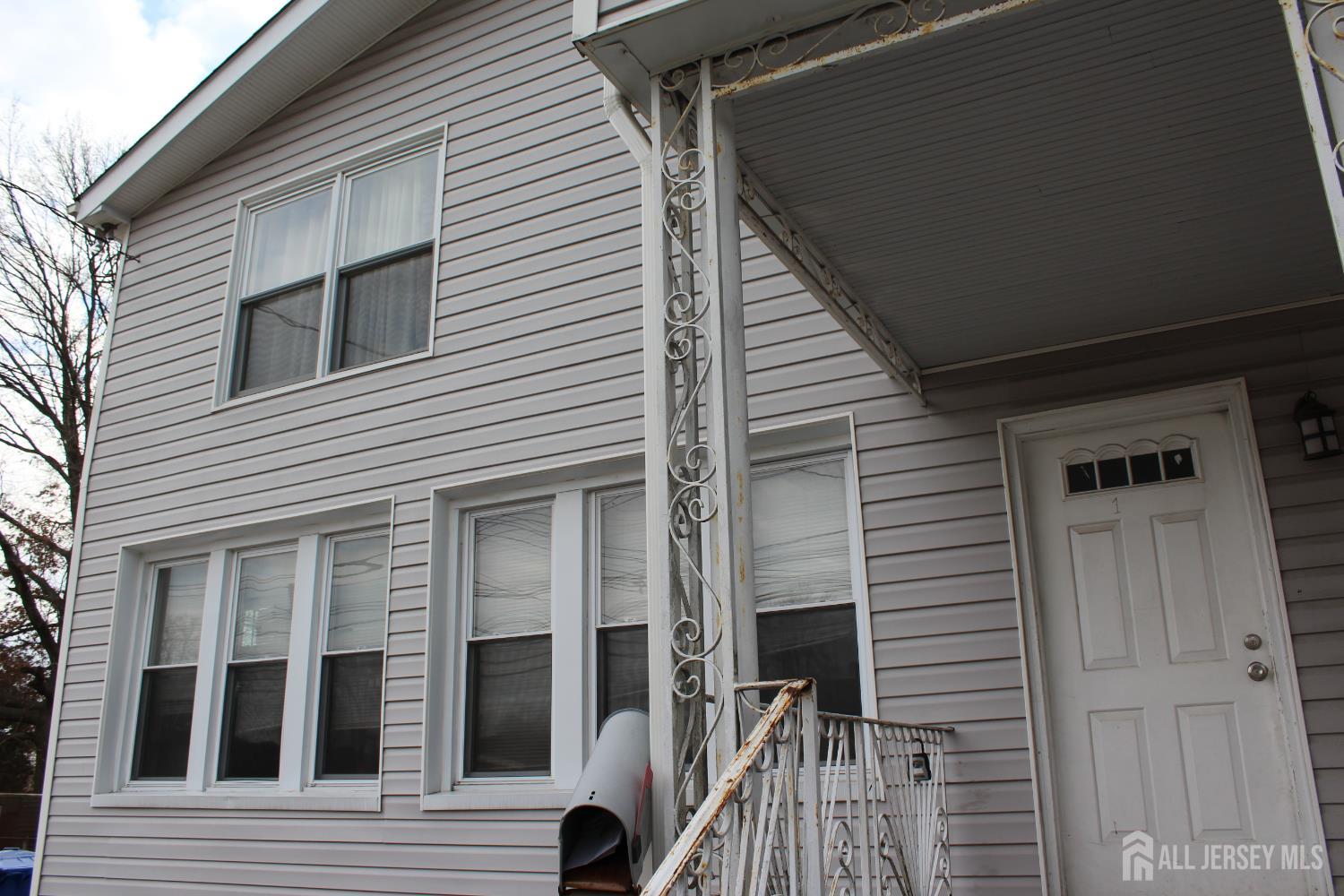 899 Green Street, Unit 1 Iselin, NJ 08830 - Photo 2 of 45 a view of a house with a door and wooden floor