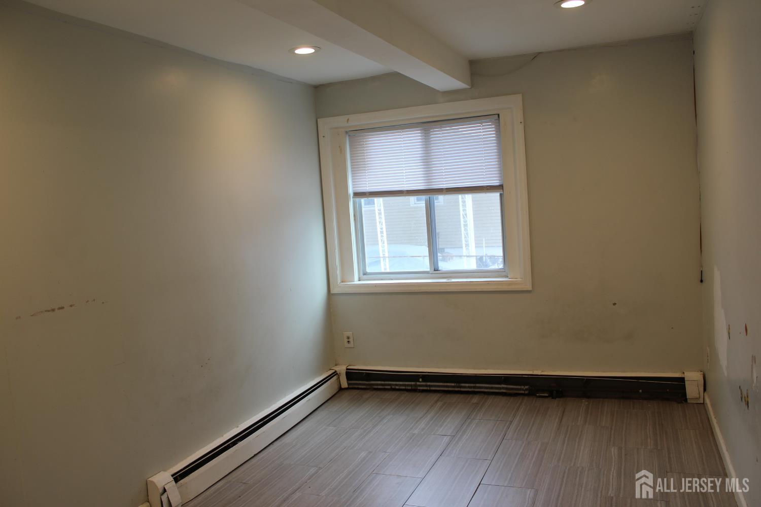 899 Green Street, Unit 1 Iselin, NJ 08830 - Photo 25 of 45 an empty room with a window