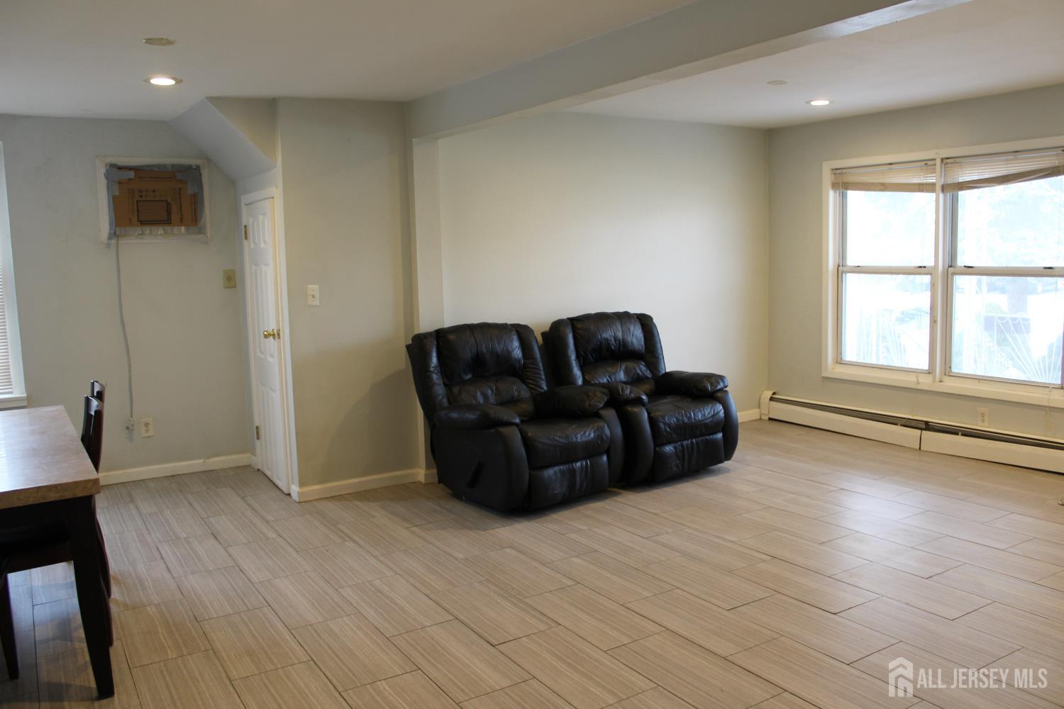 899 Green Street, Unit 1 Iselin, NJ 08830 - Photo 3 of 45 a living room with furniture