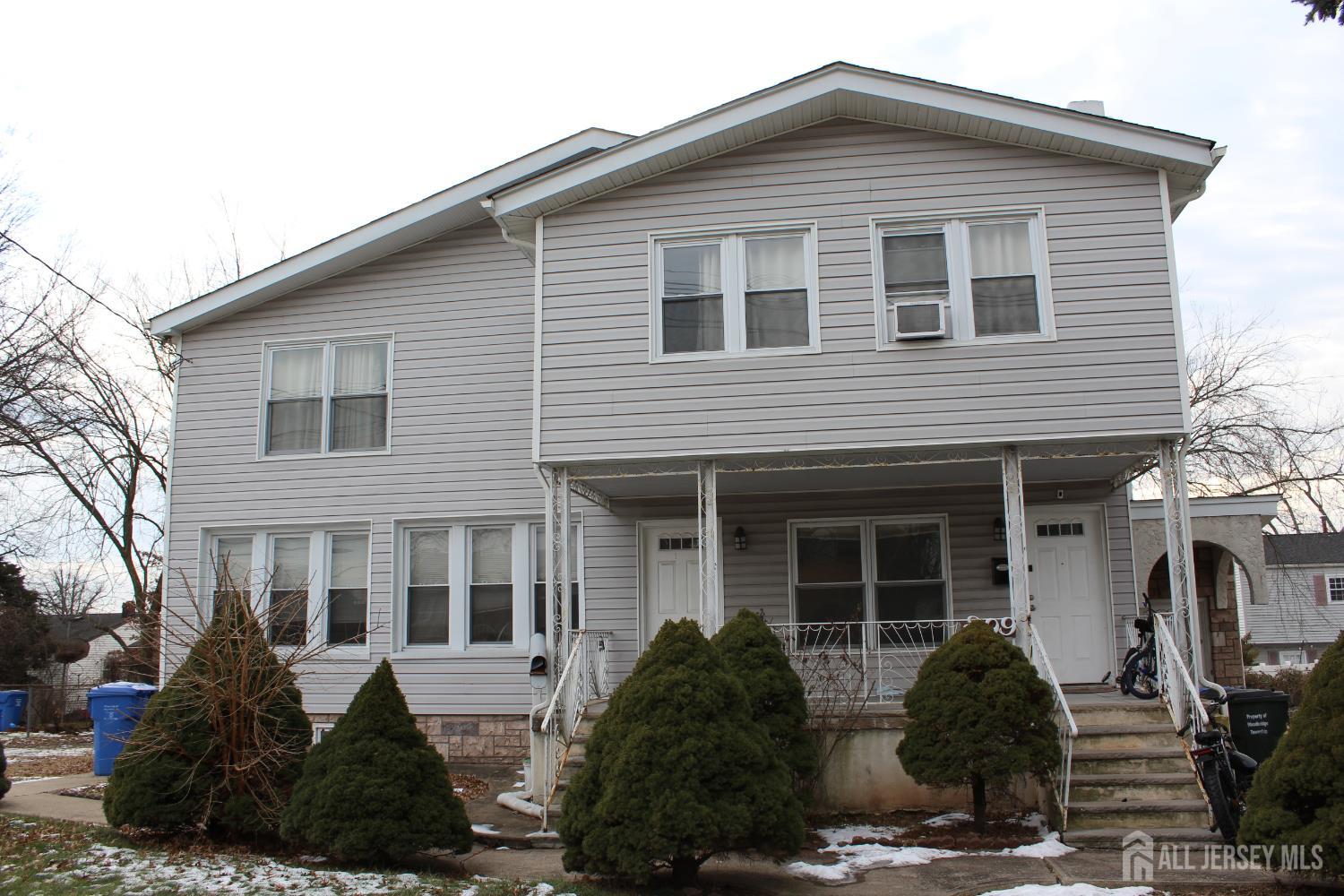 899 Green Street, Unit 1 Iselin, NJ 08830 - Photo 45 of 45 a front view of a house with large windows