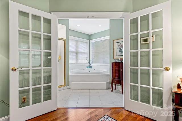 a bathroom with a bathtub and a shower