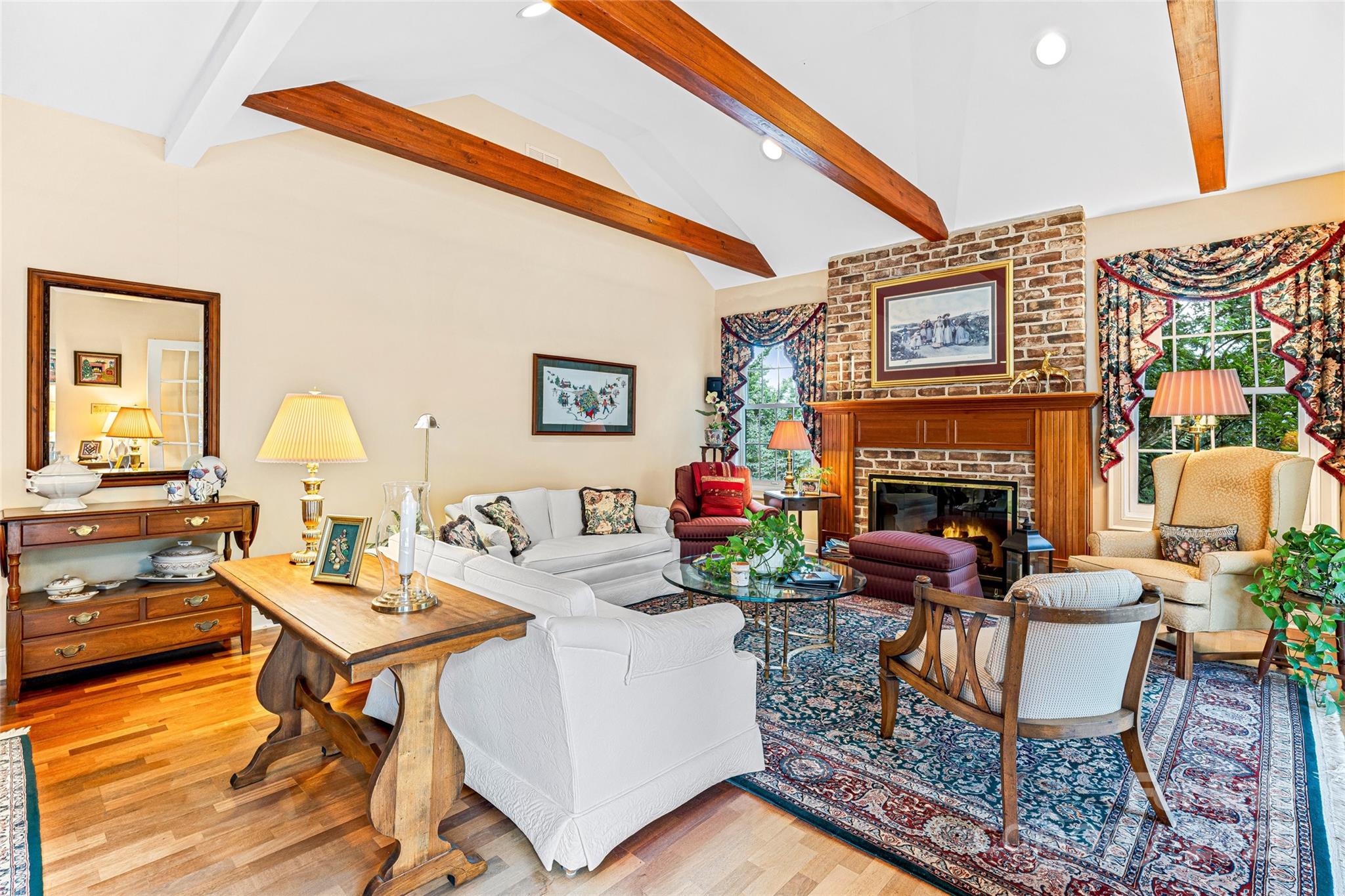 842 Rickel Drive Hendersonville, NC 28739 - Photo 2 of 48 a living room with furniture a fireplace and a table