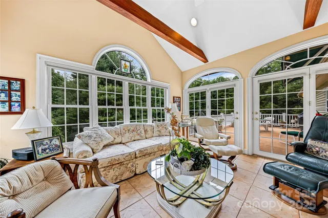 a view of a chairs and table in the balcony