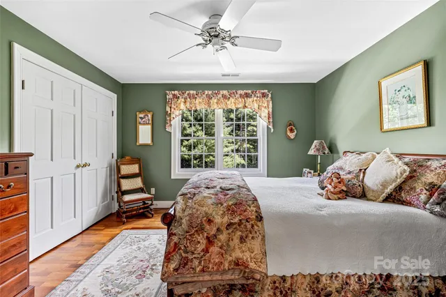 a bedroom with bed and a window