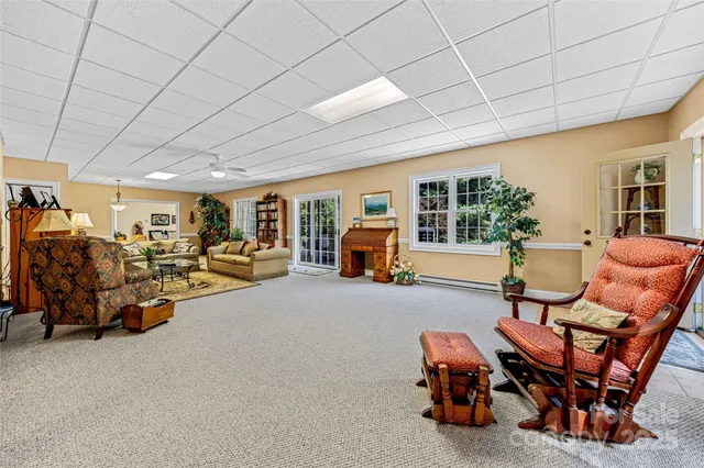 a living room with furniture and a rug
