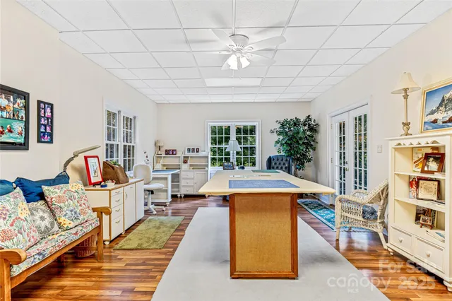 a kitchen with granite countertop cabinets stove top oven and microwave