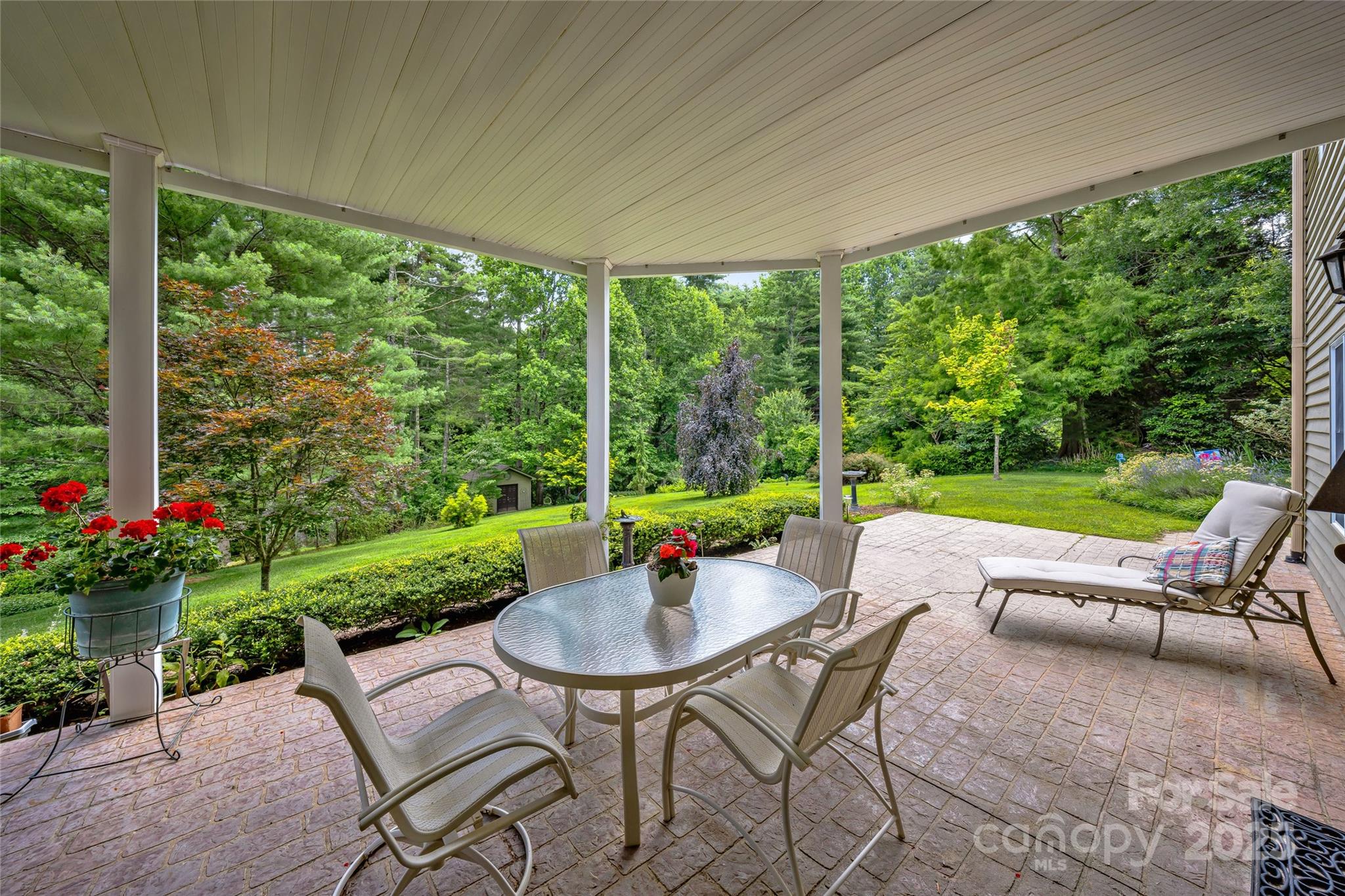842 Rickel Drive Hendersonville, NC 28739 - Photo 39 of 48 a view of a patio with a table chairs and a yard