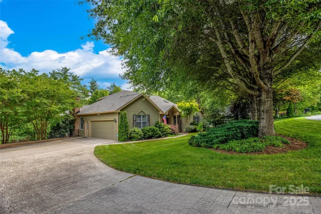 a view of a house with brick walls and potted plants