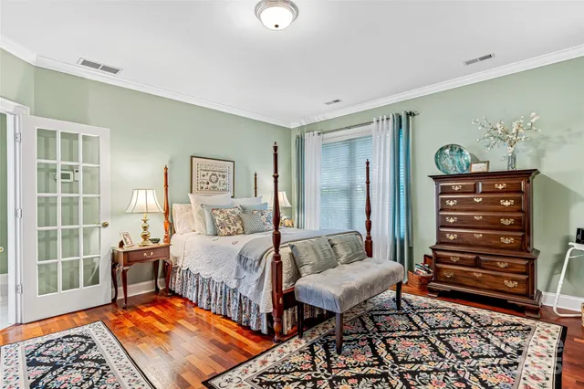 a bedroom with two beds and a large window