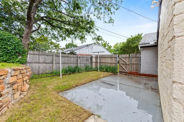 a view of backyard with green space