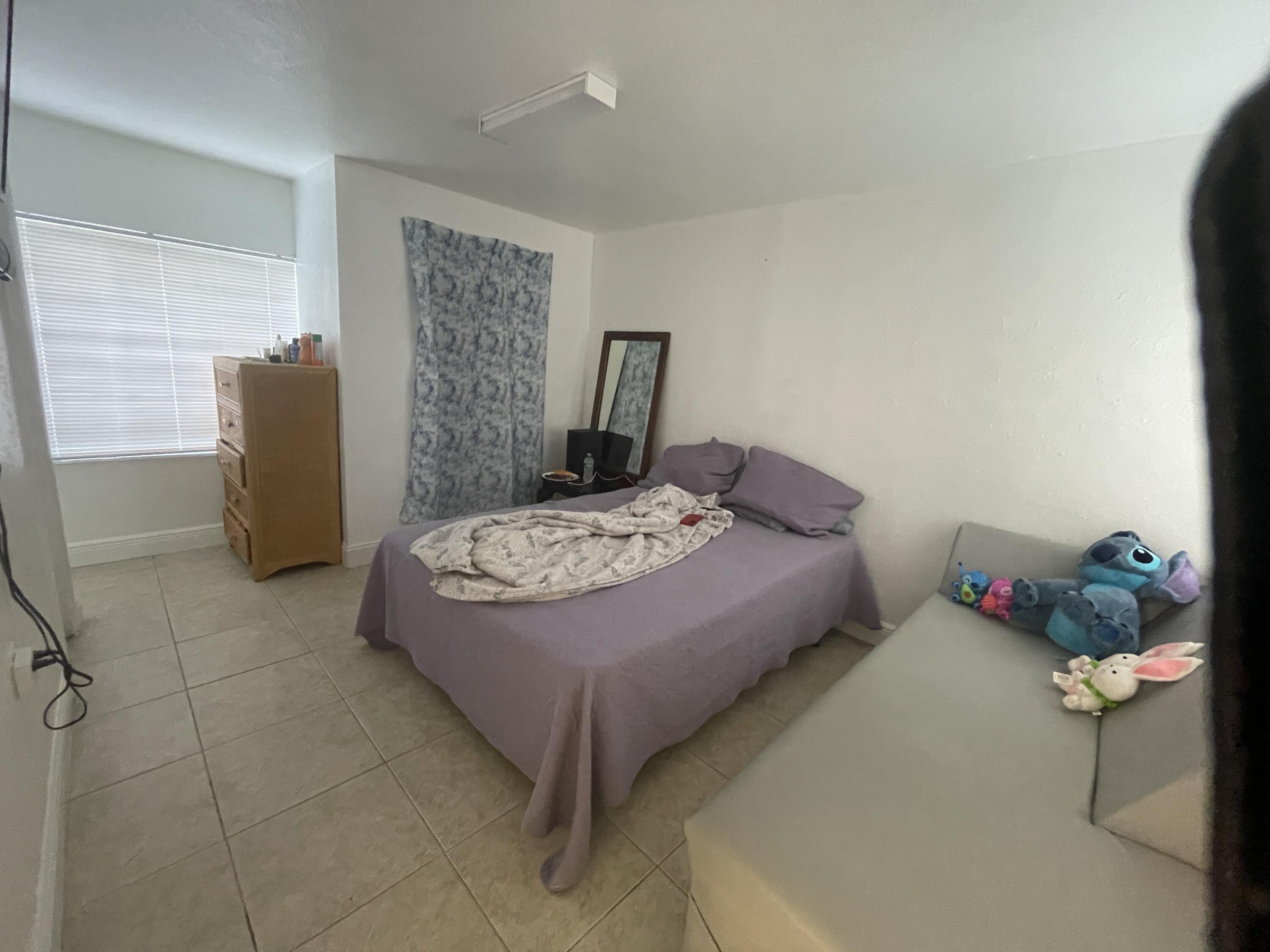625 73rd Street, Unit AB Marathon, FL 33050 - Photo 11 of 23 a bedroom with a bed and dresser