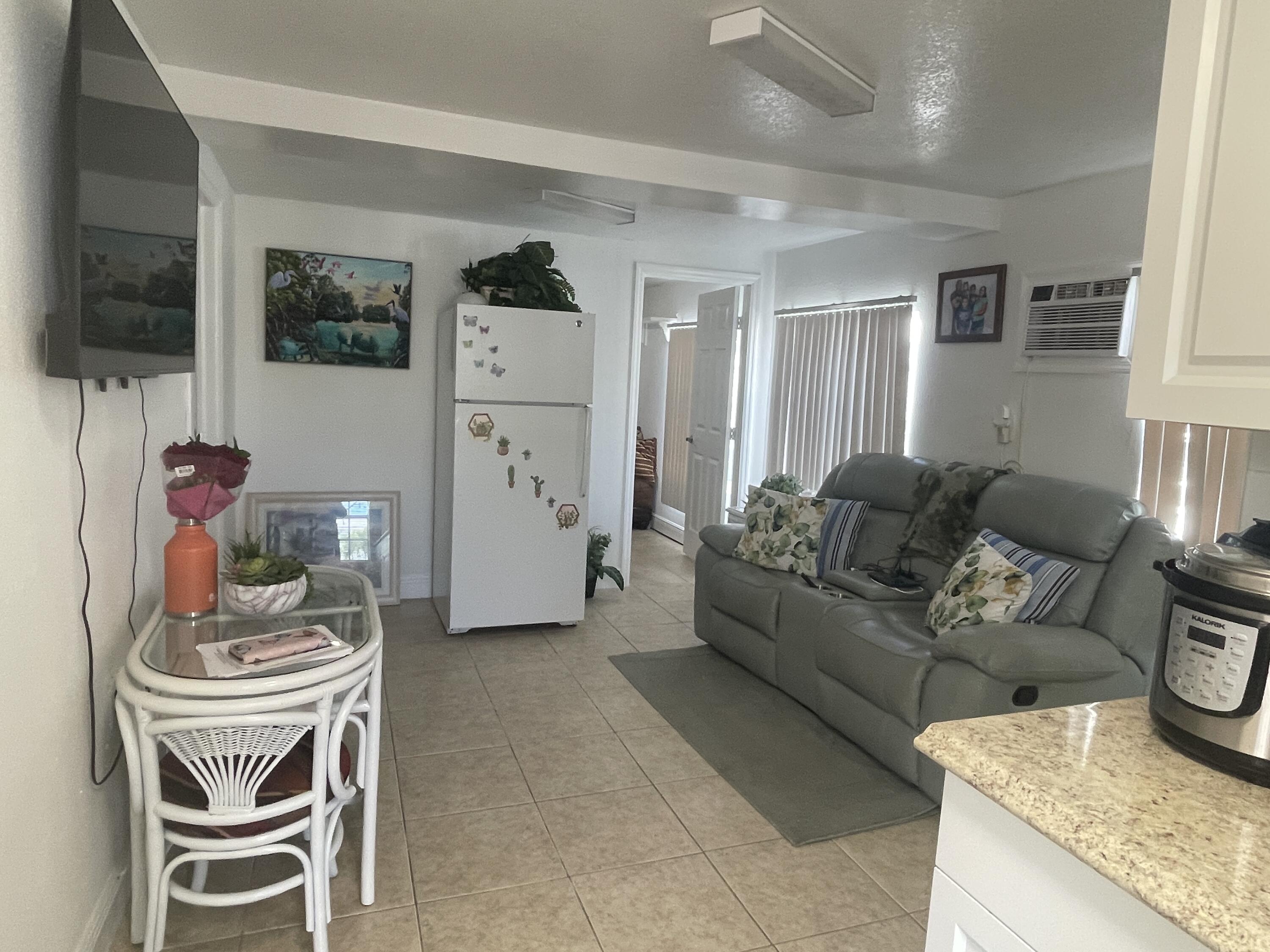 625 73rd Street, Unit AB Marathon, FL 33050 - Photo 15 of 23 a living room with furniture and a flat screen tv