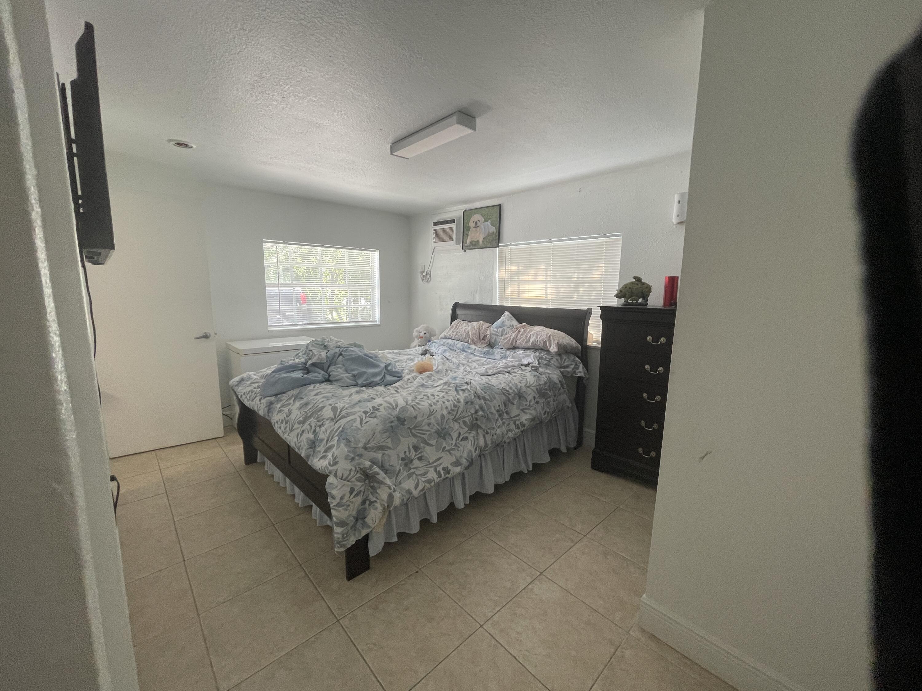 625 73rd Street, Unit AB Marathon, FL 33050 - Photo 16 of 23 a bedroom with a bed and window