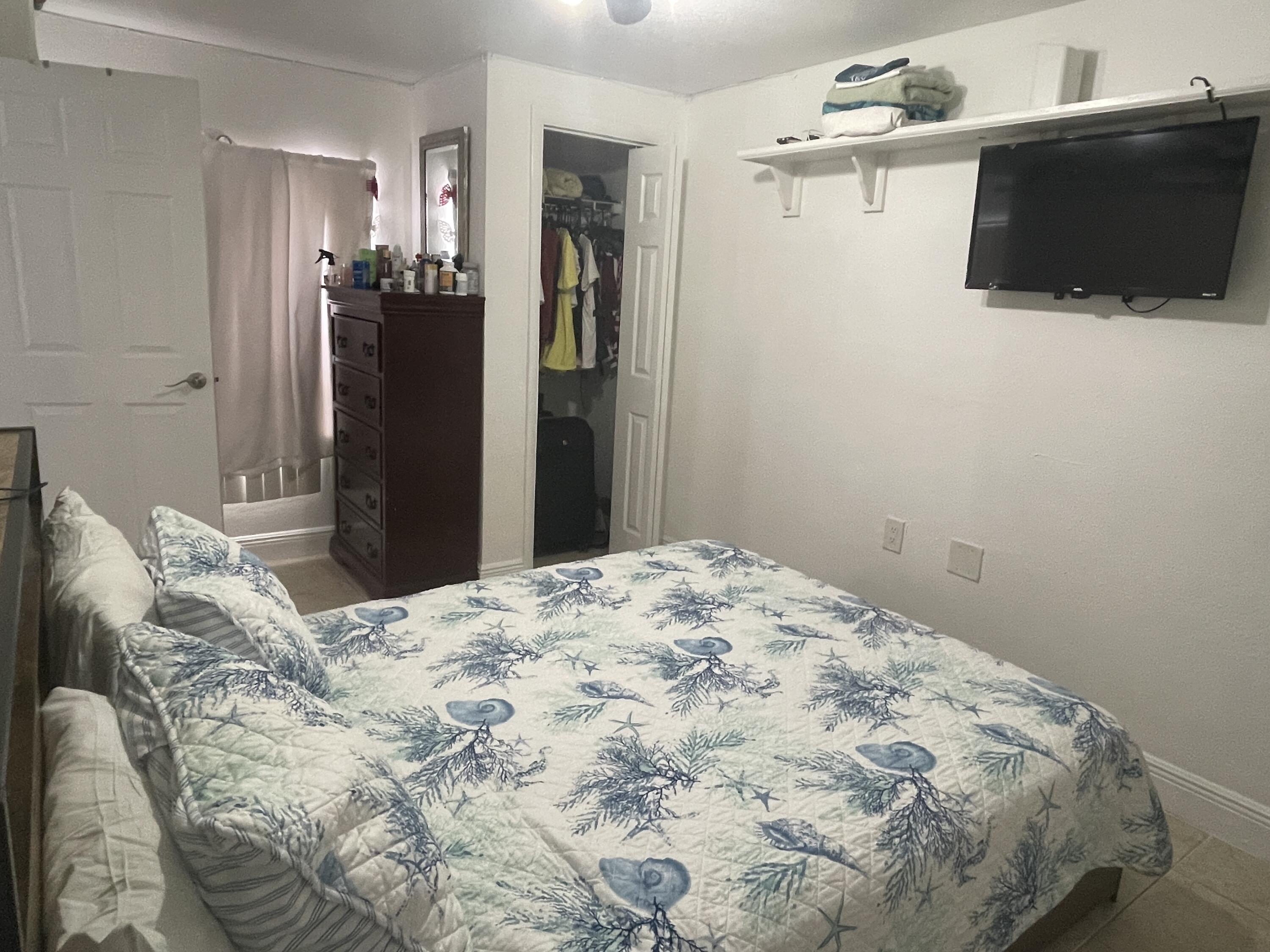 625 73rd Street, Unit AB Marathon, FL 33050 - Photo 20 of 23 a bedroom with a bed and a television