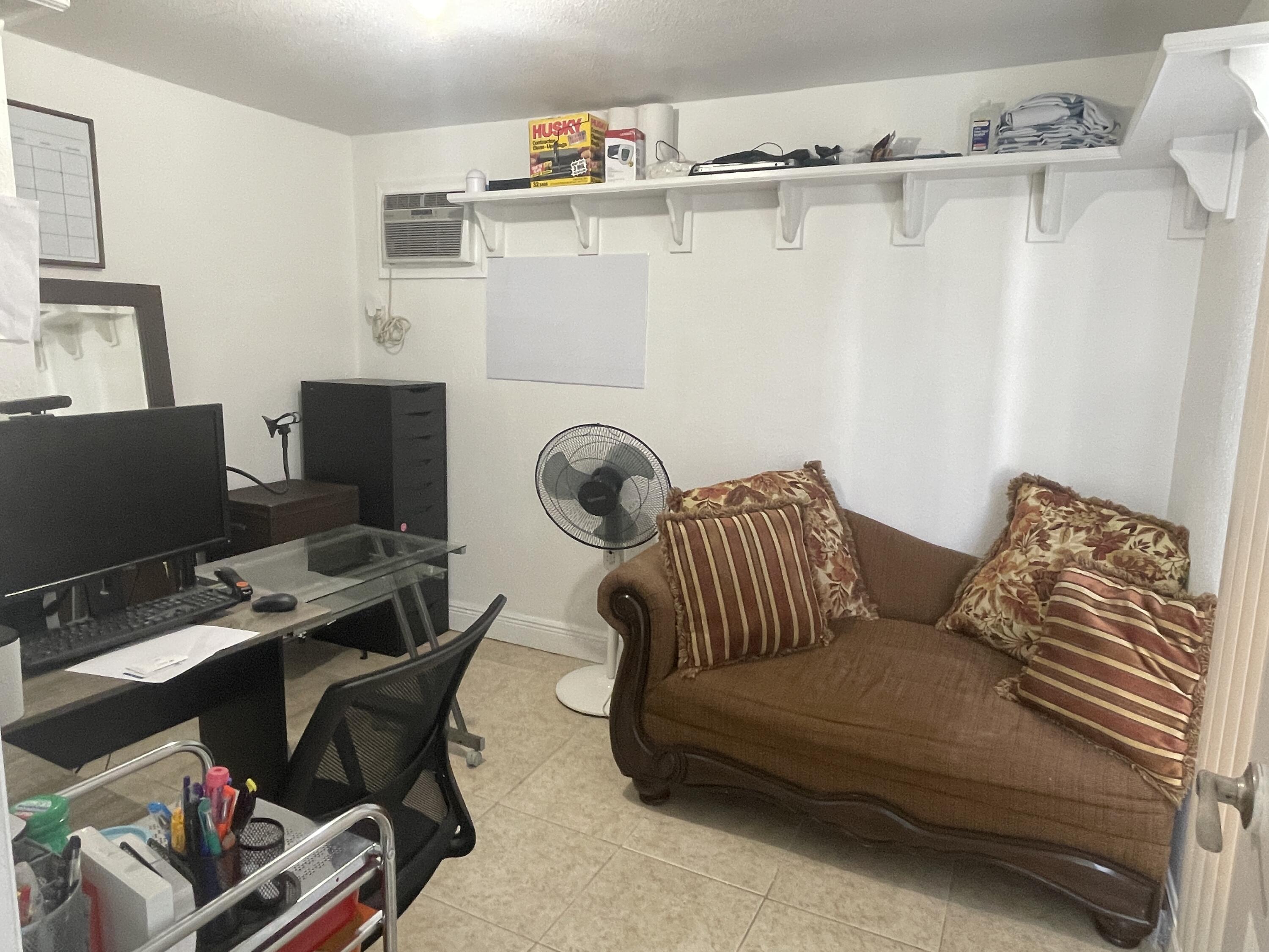 625 73rd Street, Unit AB Marathon, FL 33050 - Photo 22 of 23 a bedroom with furniture and a window