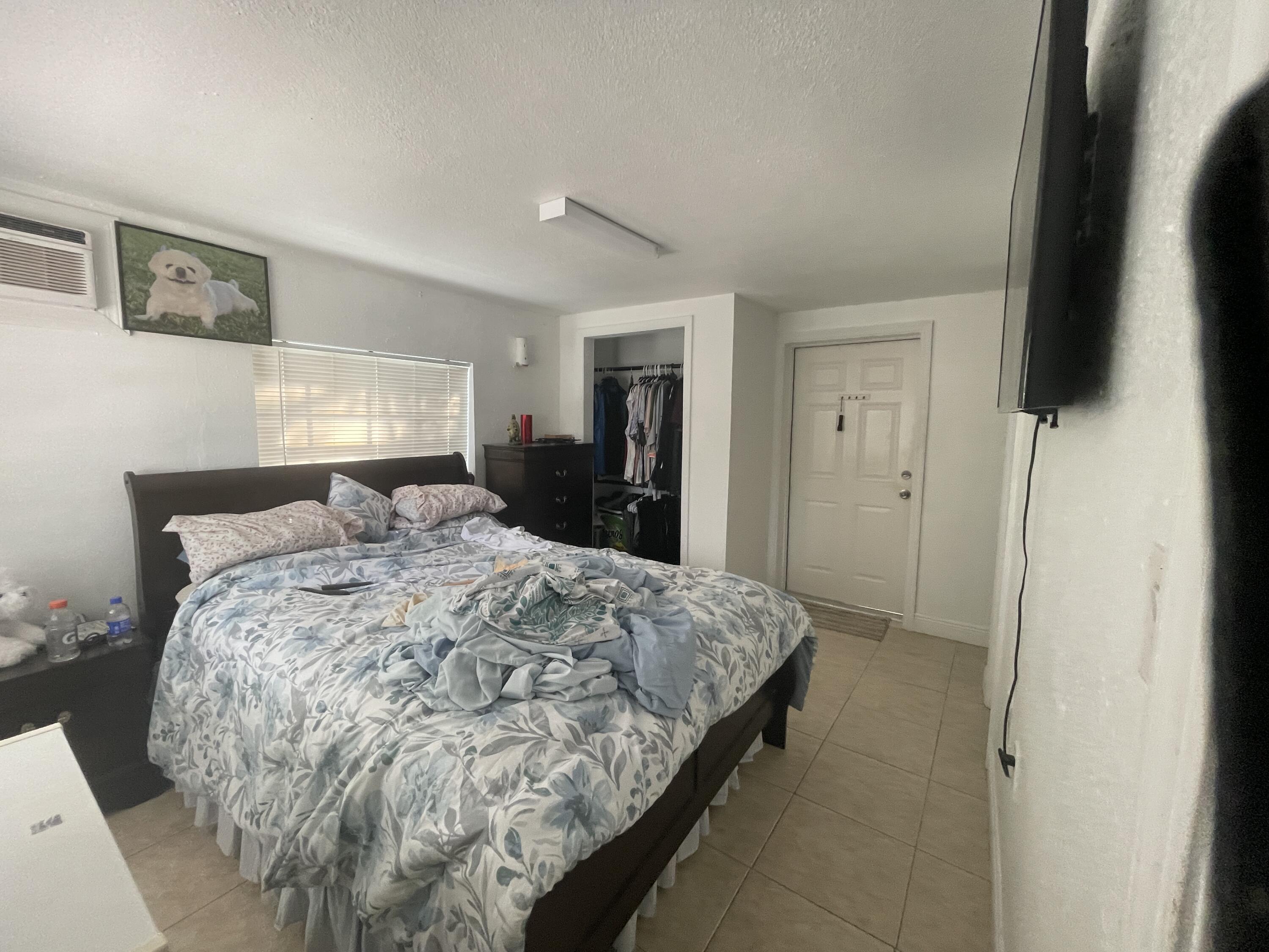 625 73rd Street, Unit AB Marathon, FL 33050 - Photo 6 of 23 a bedroom with a bed and a mirror