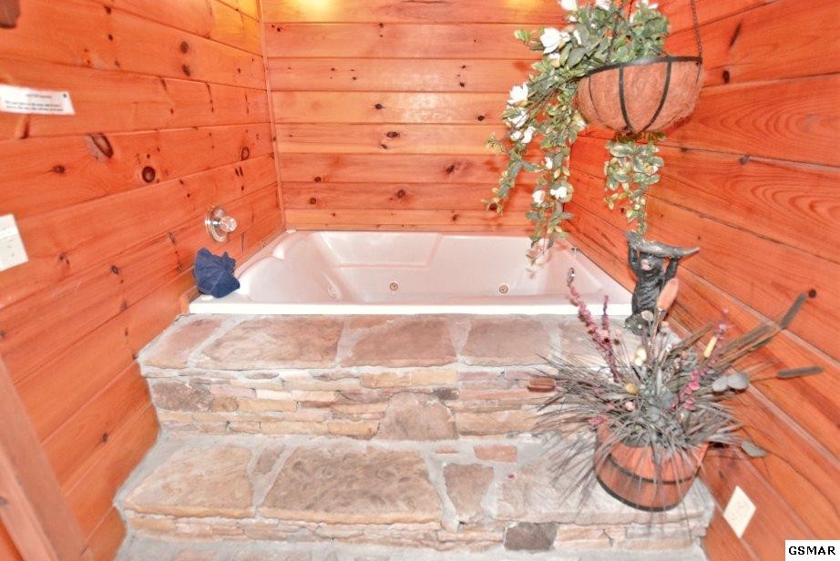524 Hideaway Ridge Circle Sevierville, TN 37862 - Photo 15 of 30 a bathroom with a bathtub and shower
