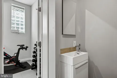 a utility room with dryer washer and a view of living area