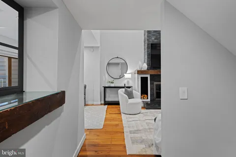 a view of a hallway with seating area