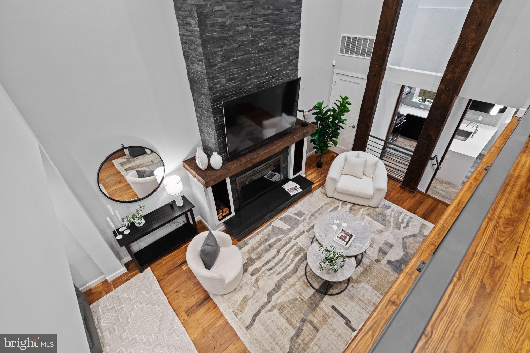 2030 Ranstead Street Philadelphia, PA 19103 - Photo 16 of 49 a living room with furniture and a fireplace