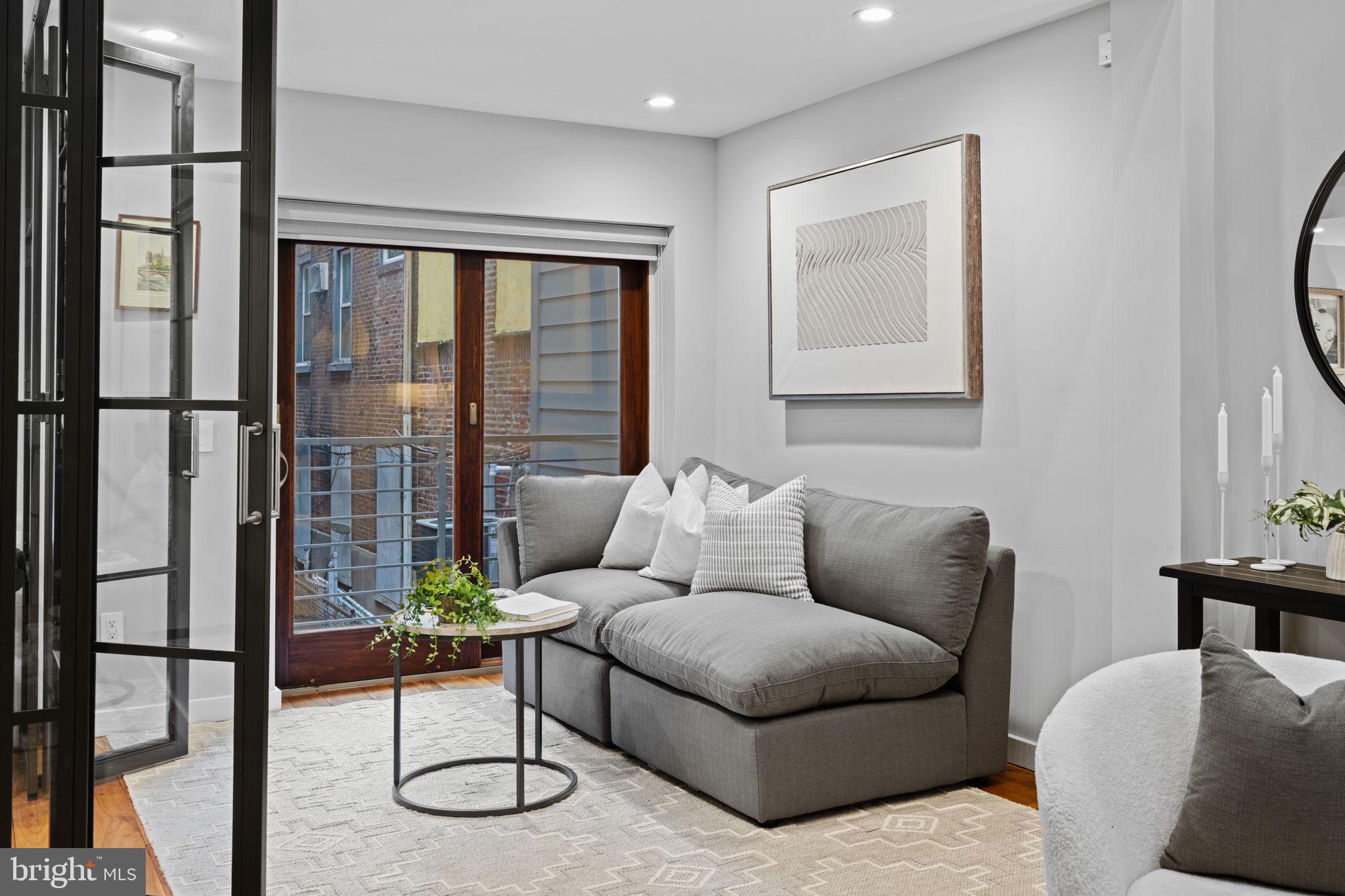 2030 Ranstead Street Philadelphia, PA 19103 - Photo 19 of 49 a living room with furniture and a window