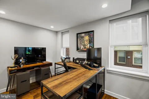 a room with furniture and a flat screen tv