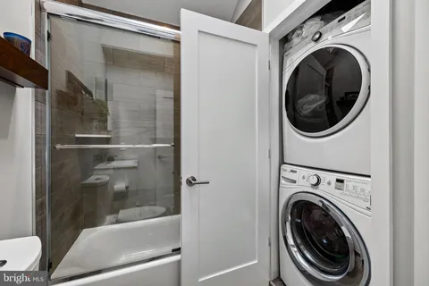 a view of a hallway with washer and dryer