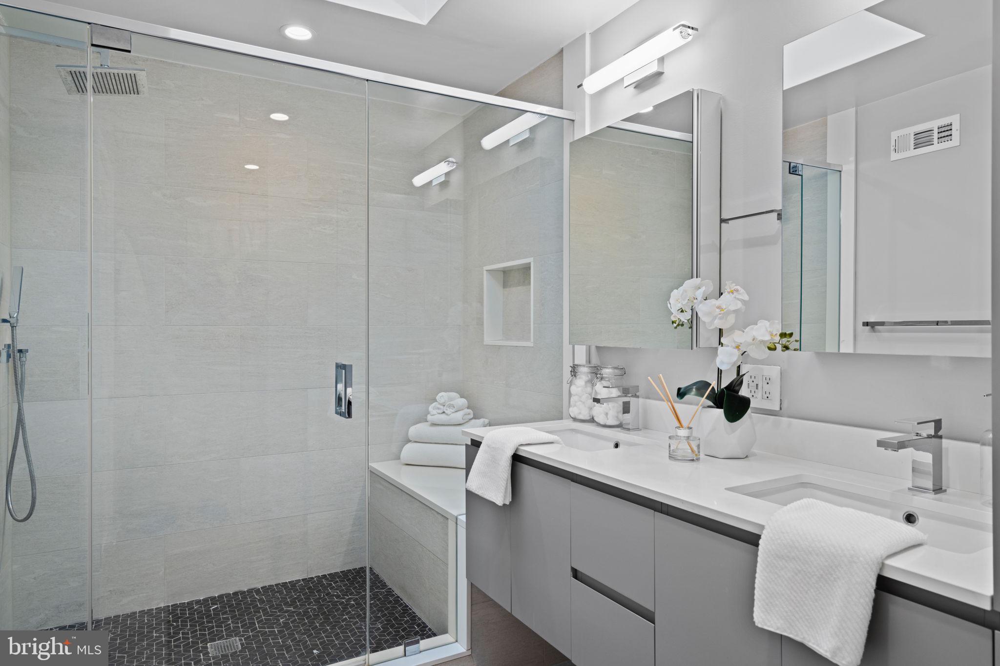 2030 Ranstead Street Philadelphia, PA 19103 - Photo 39 of 49 a bathroom with a double vanity sink mirror and double