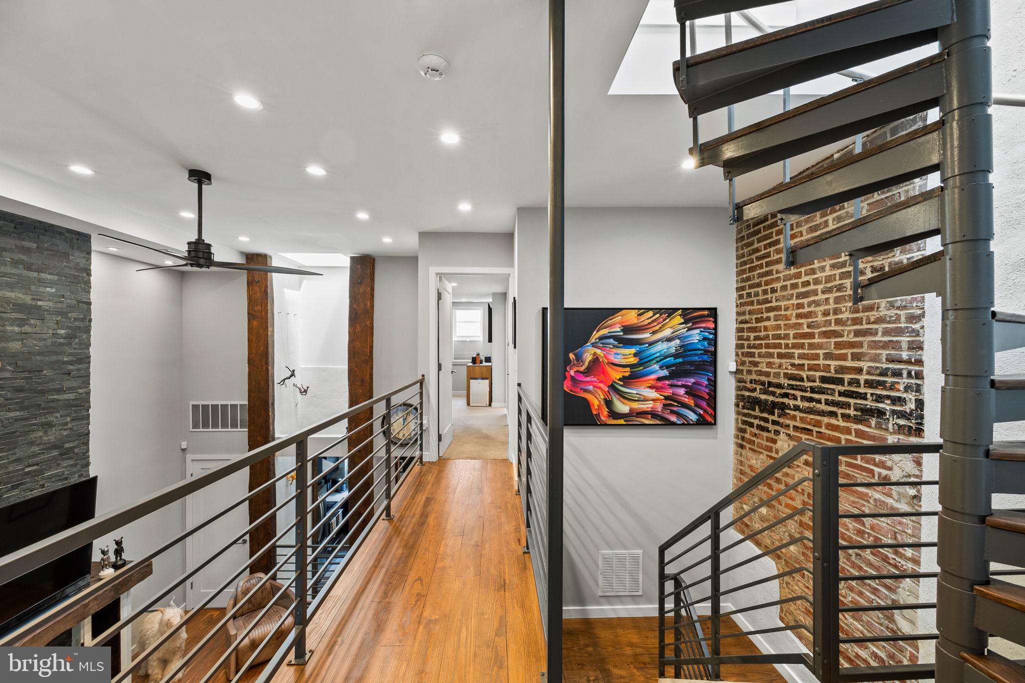 2030 Ranstead Street Philadelphia, PA 19103 - Photo 41 of 49 a view of a hallway with wooden floor and furniture