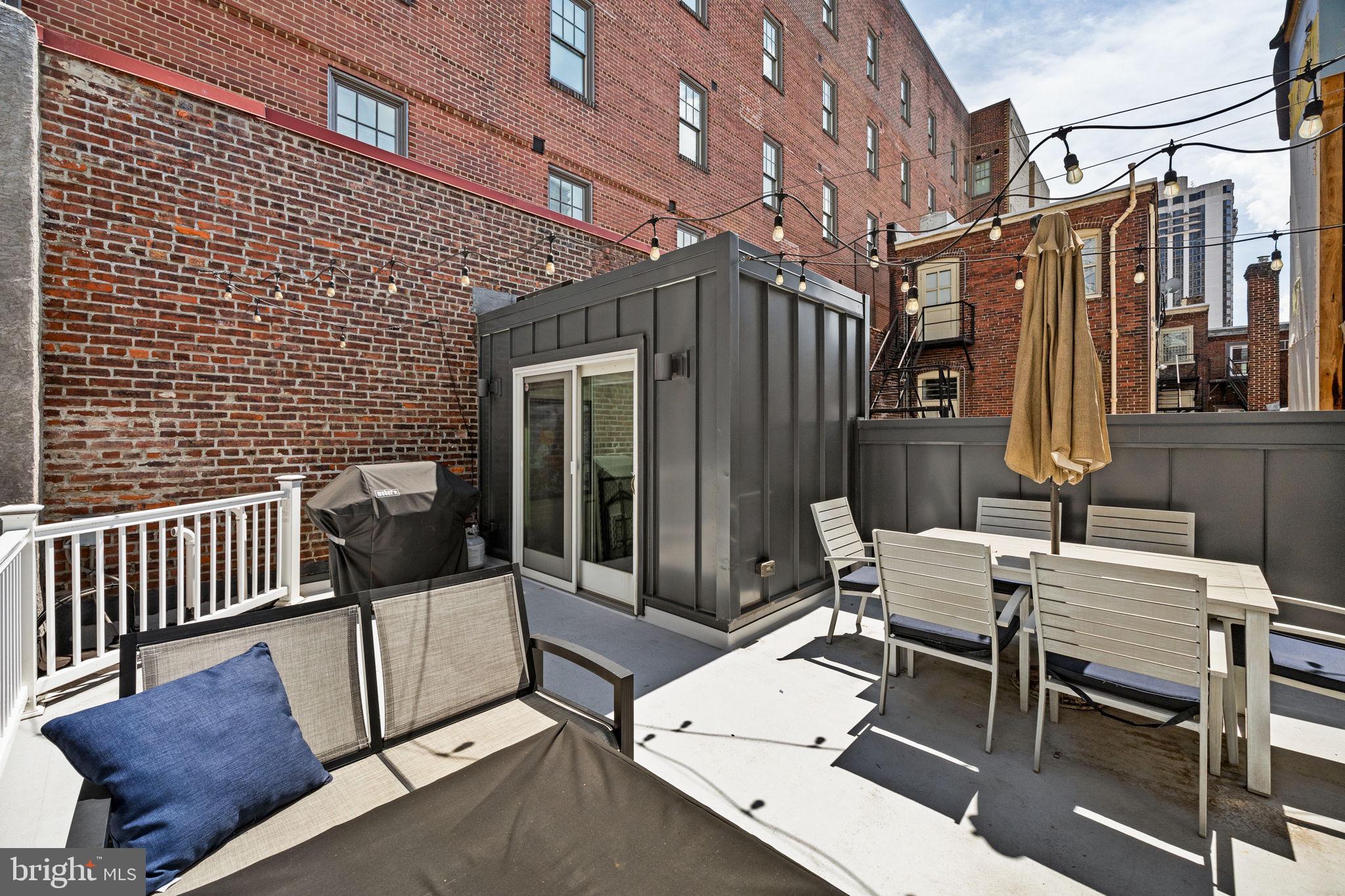 2030 Ranstead Street Philadelphia, PA 19103 - Photo 46 of 49 a view of a patio with a table and chairs