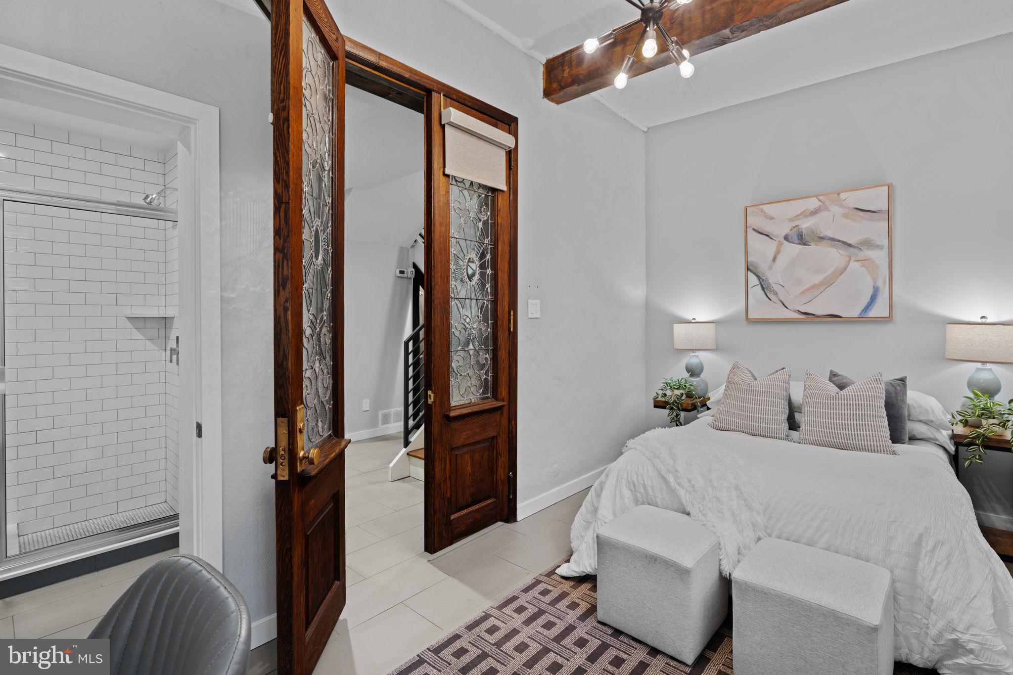 2030 Ranstead Street Philadelphia, PA 19103 - Photo 9 of 49 a bedroom with a bed and a mirror