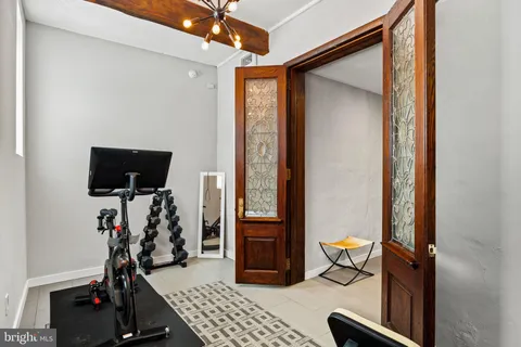 a view of a livingroom with furniture and a window