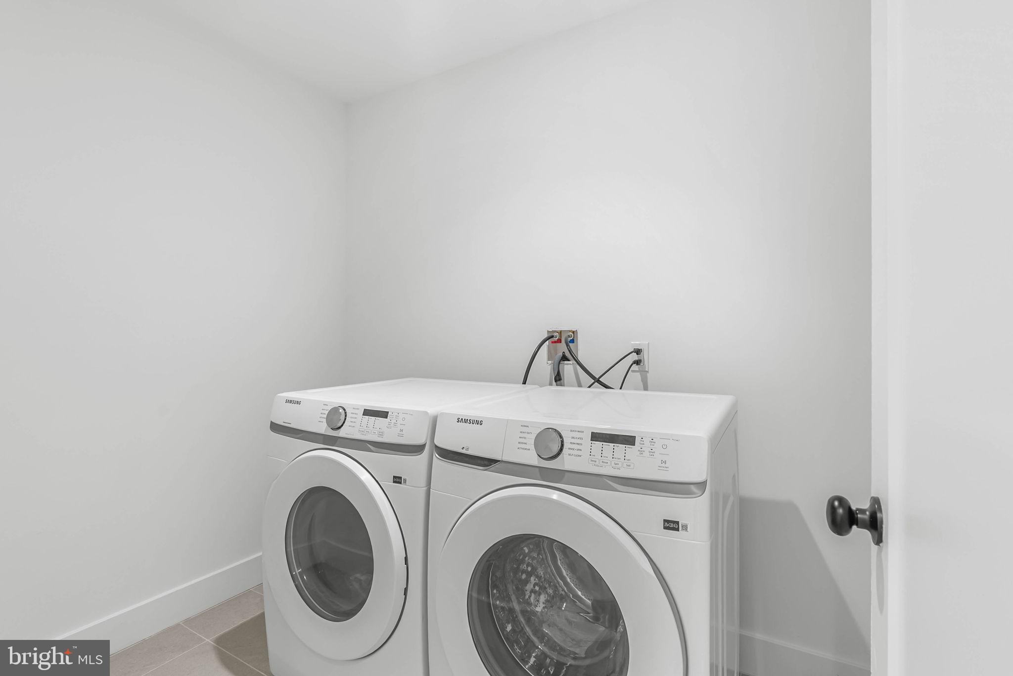 635 North 7th Street, Unit H2A Philadelphia, PA 19123 - Photo 18 of 25 a utility room with dryer and washer