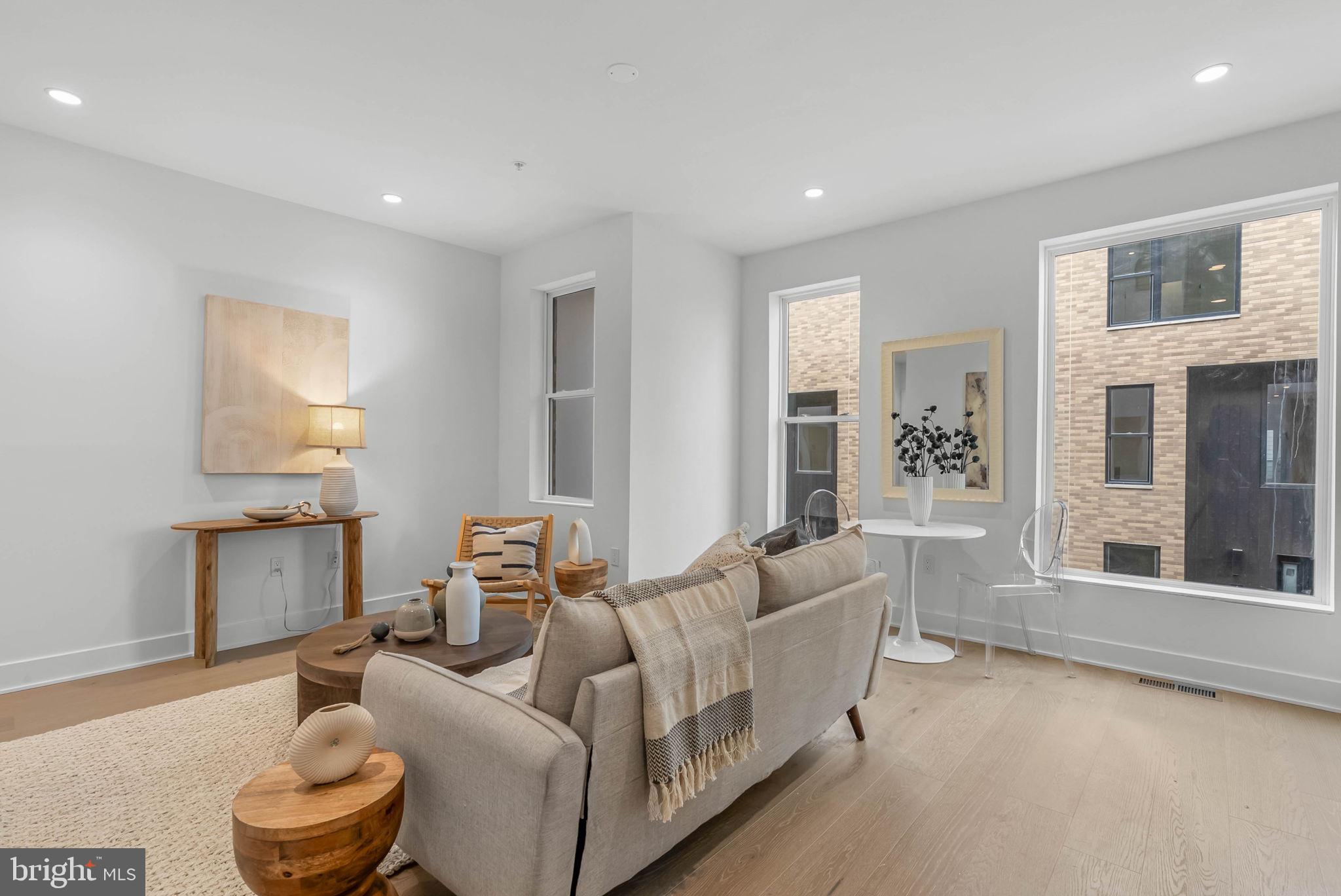 635 North 7th Street, Unit H2A Philadelphia, PA 19123 - Photo 5 of 25 a living room with furniture and a large window