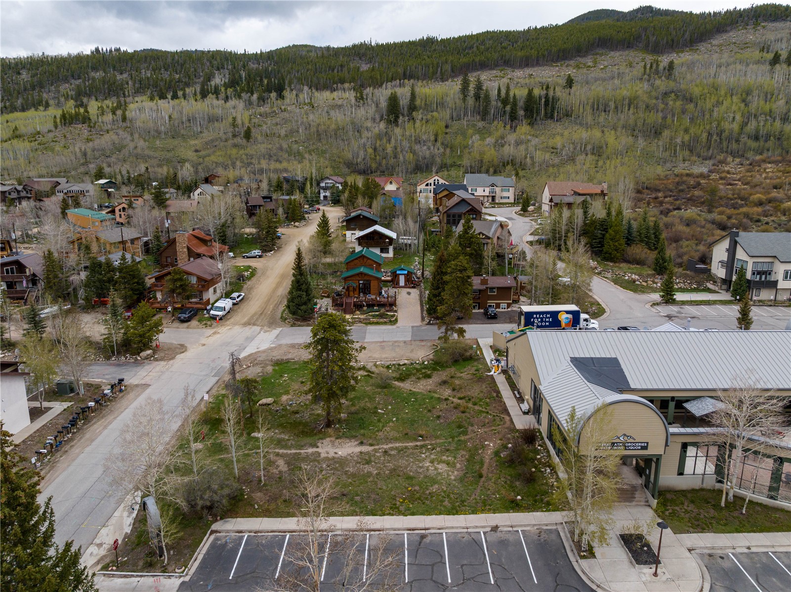 57 Rasor Drive Keystone, CO 80435 - Photo 4 of 22 Aerial view of residential area with a heavily wooded area and mountains