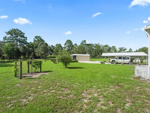 a view of a backyard of the house