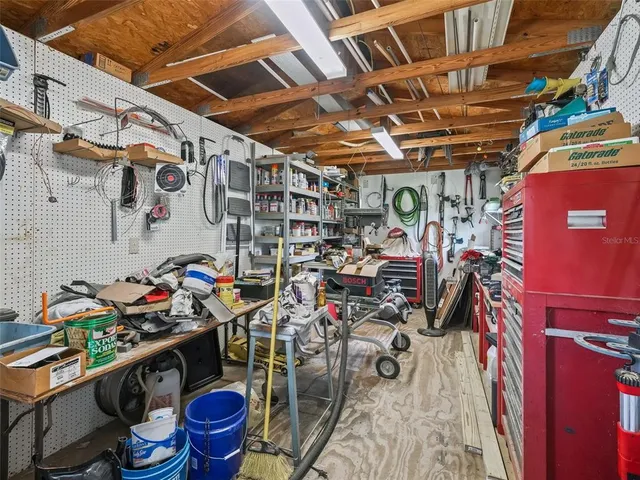 a kitchen with a sink and wooden cabinets