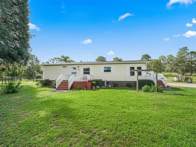 a view of a deck with a yard