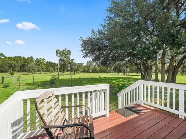 a kitchen with a stove a sink and a refrigerator