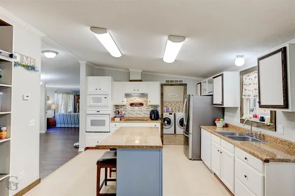 a large kitchen with cabinets