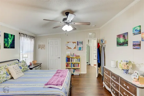a bedroom with furniture and a book shelf