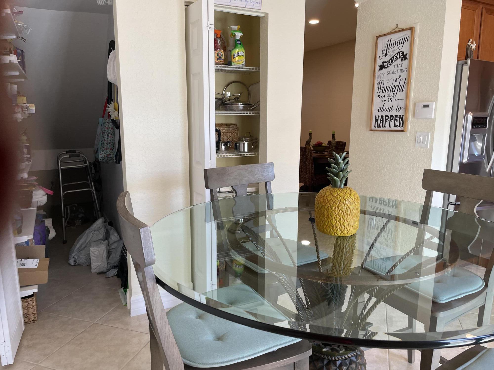 1157 Northwest 18th Avenue Boca Raton, FL 33431 - Photo 13 of 22 a view of dining room with two mirror and cabinets